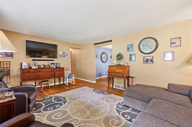 living area featuring wood finished floors and baseboards