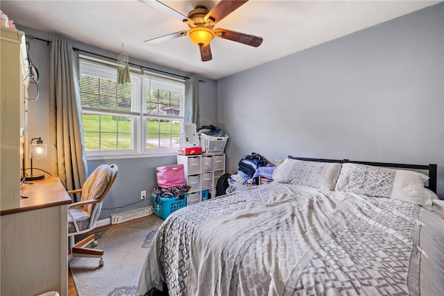 bedroom with baseboards, a desk, and ceiling fan