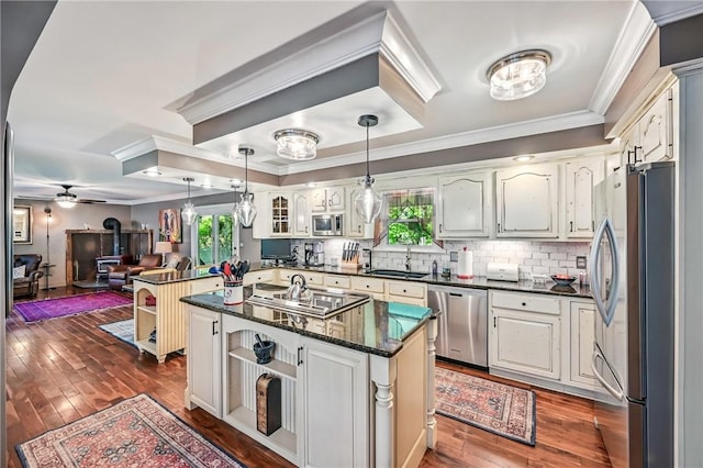 9935 Greiser Rd, Conneaut Lake Cra, PA 16316 - kitchen featuring stainless steel appliances, ornamental molding, a sink, dark wood finished floors, and hanging light fixtures