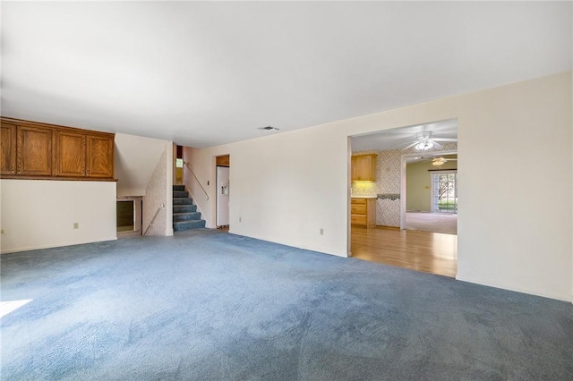 118 Tangelo Dr, Jefferson Hills, PA 15025 - unfurnished living room featuring light carpet, stairway, and a ceiling fan
