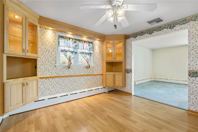 118 Tangelo Dr, Jefferson Hills, PA 15025 - unfurnished room with wallpapered walls, a baseboard heating unit, light wood-type flooring, and ceiling fan
