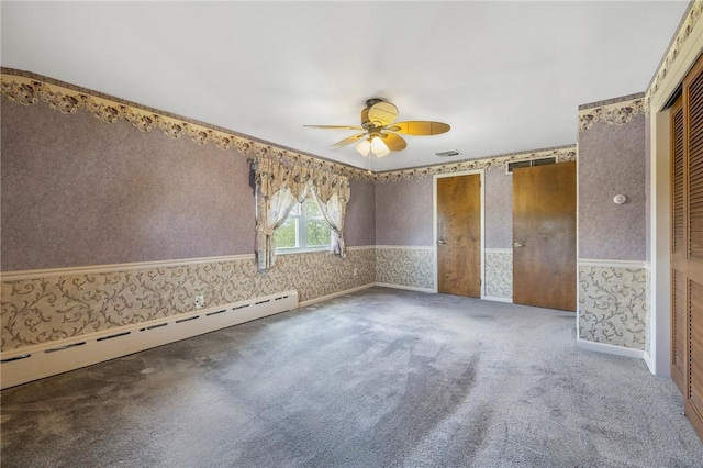 118 Tangelo Dr, Jefferson Hills, PA 15025 - carpeted empty room with wallpapered walls, a baseboard heating unit, a ceiling fan, and wainscoting