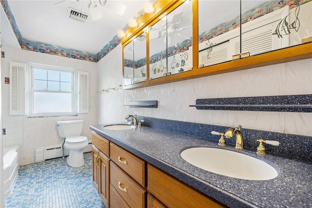 118 Tangelo Dr, Jefferson Hills, PA 15025 - bathroom featuring toilet, a bath, baseboard heating, double vanity, and ceiling fan