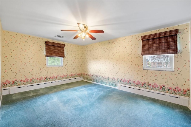 118 Tangelo Dr, Jefferson Hills, PA 15025 - empty room featuring wallpapered walls, a baseboard radiator, carpet flooring, and a ceiling fan