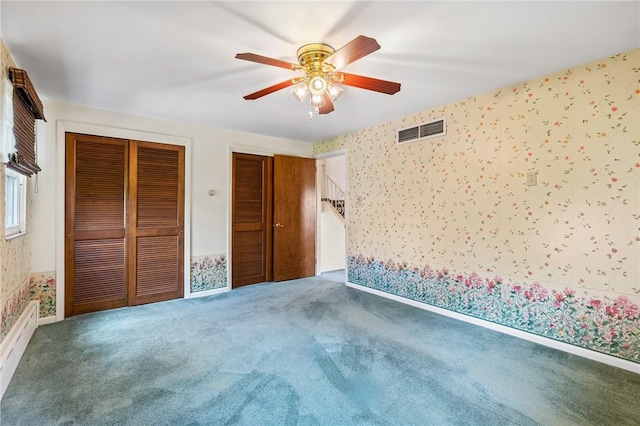 118 Tangelo Dr, Jefferson Hills, PA 15025 - unfurnished bedroom with wallpapered walls, multiple closets, carpet flooring, and a ceiling fan