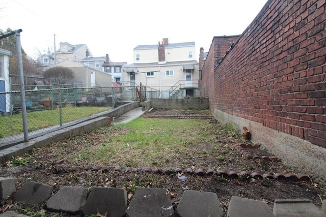 view of yard with fence and a residential view
