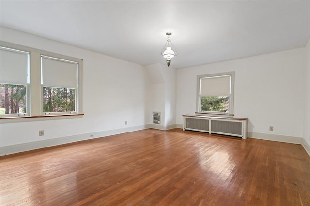 126 Oakford Park Rd, Hempfield Twp Wml, PA 15644 - empty room with radiator heating unit, wood finished floors, baseboards, and heating unit