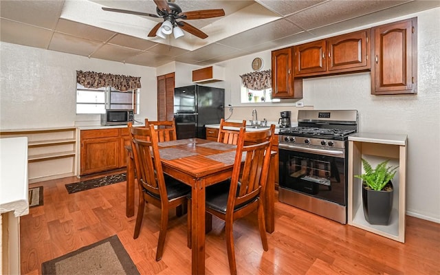5 Carrie St, Rear, Fineview, PA 15212 - dining space with ceiling fan, a drop ceiling, and light wood-type flooring