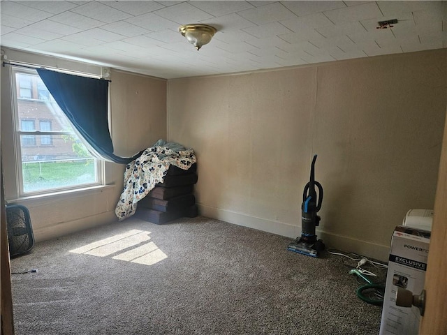 empty room with healthy amount of natural light and carpet floors