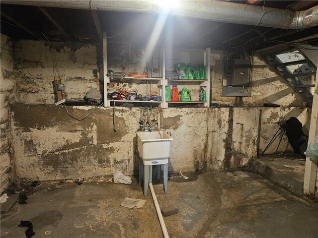 unfinished below grade area with electric panel