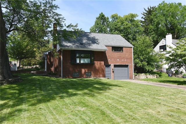 200 Graham St, Sewickley, PA 15143 - view of front of house featuring driveway, brick siding, an attached garage, a chimney, and a front yard