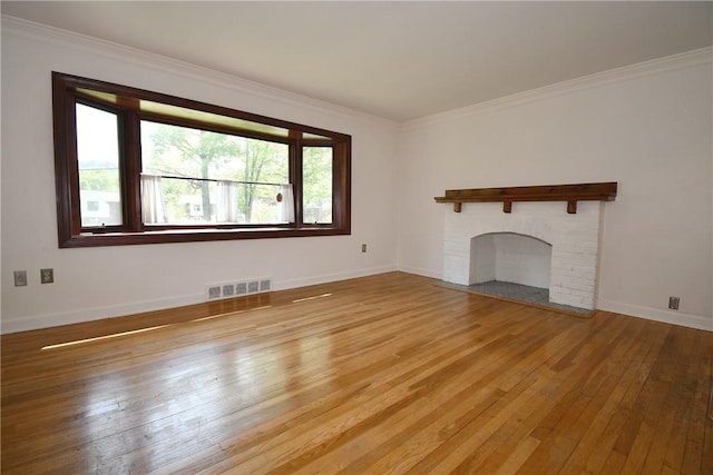 200 Graham St, Sewickley, PA 15143 - unfurnished living room with hardwood / wood-style floors, baseboards, ornamental molding, and a brick fireplace