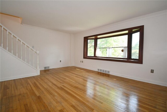 200 Graham St, Sewickley, PA 15143 - unfurnished room featuring stairway, light wood finished floors, crown molding, and baseboards