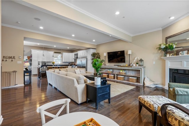 234 College Ave, Oakmont, PA 15139 - living room featuring dark wood-type flooring, ornamental molding, recessed lighting, a glass covered fireplace, and baseboards
