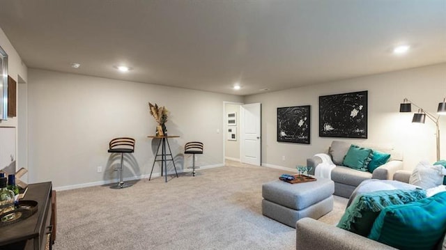 living room featuring recessed lighting, carpet floors, and baseboards