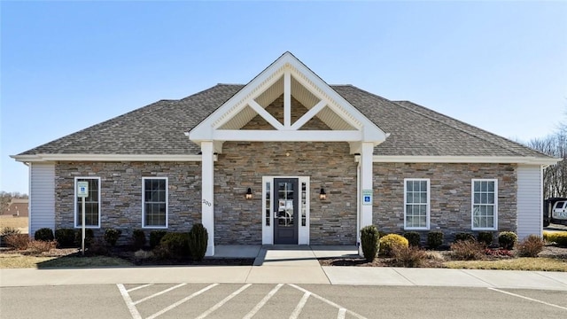 view of building exterior featuring uncovered parking