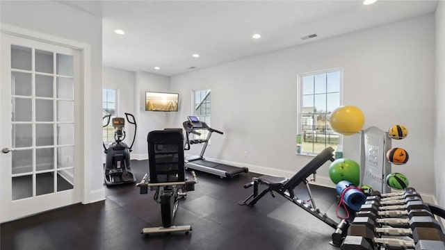 exercise area featuring healthy amount of natural light, recessed lighting, and baseboards