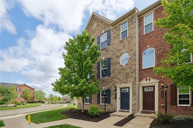 view of property with brick siding
