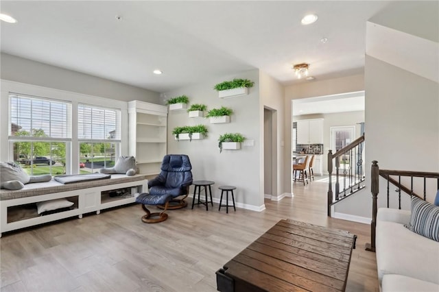 sitting room featuring recessed lighting, light wood-style floors, and baseboards