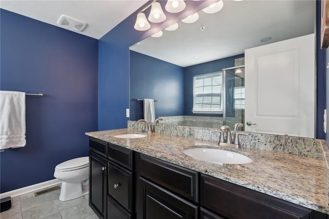 bathroom with toilet, baseboards, a shower stall, tile patterned floors, and double vanity