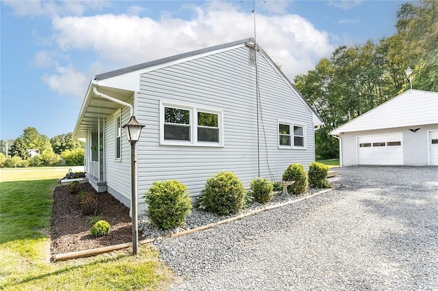 745 N Broad St, Pine Twp Mer, PA 16127 - view of side of property featuring an outbuilding, a detached garage, and a lawn