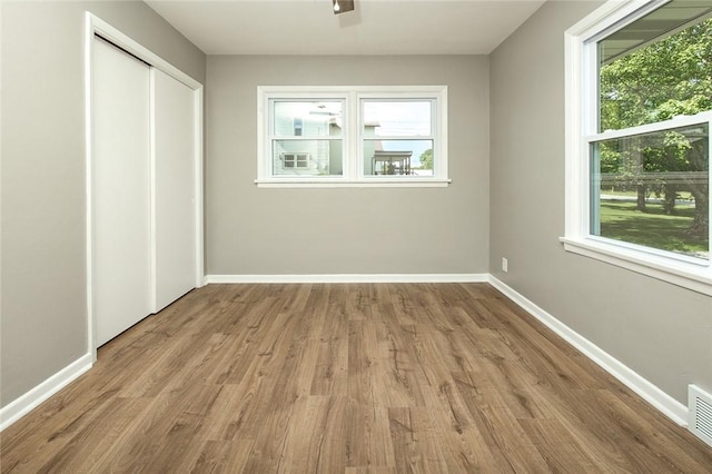745 N Broad St, Pine Twp Mer, PA 16127 - unfurnished bedroom featuring wood finished floors, baseboards, and a closet