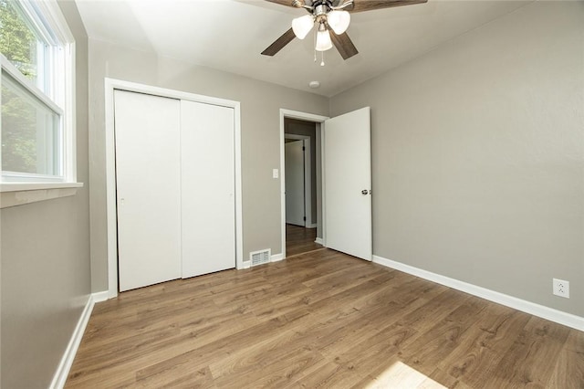745 N Broad St, Pine Twp Mer, PA 16127 - unfurnished bedroom featuring baseboards, light wood finished floors, a closet, and a ceiling fan