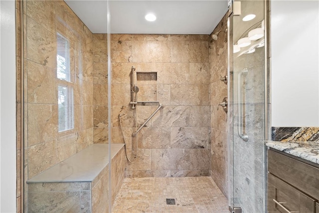 bathroom featuring a shower stall, vanity, and recessed lighting