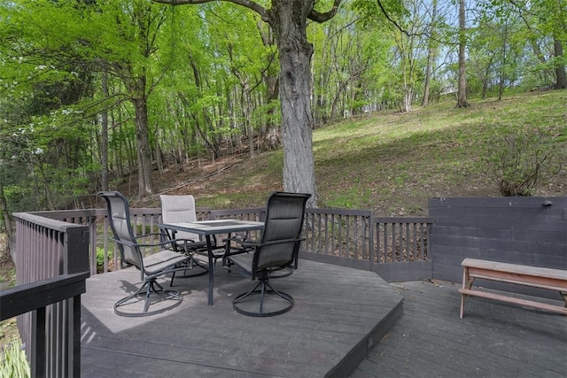 deck featuring outdoor dining area