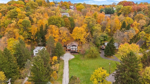view from above of property featuring a heavily wooded area