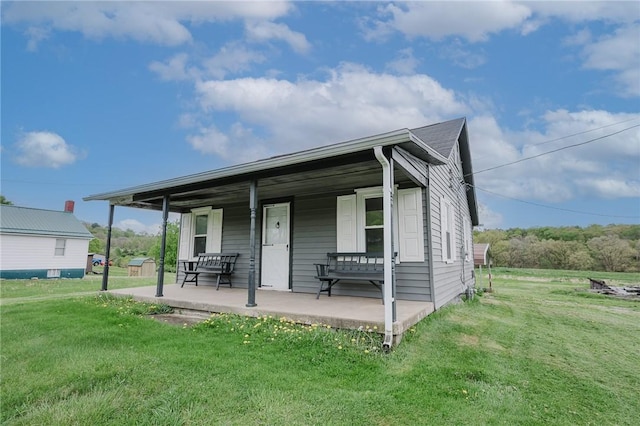 336 Walkchalk Rd, East Franklin Twp, PA 16201 - view of front facade with a porch and a front yard