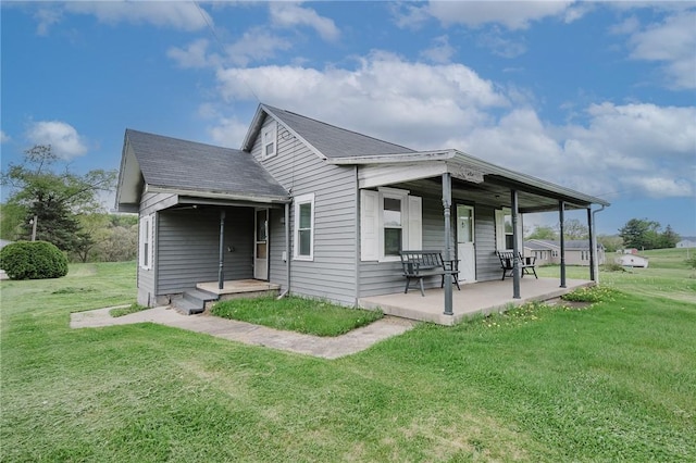 336 Walkchalk Rd, East Franklin Twp, PA 16201 - back of property featuring a yard, a porch, and a shingled roof