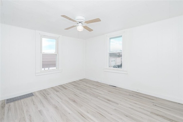 336 Walkchalk Rd, East Franklin Twp, PA 16201 - empty room with a ceiling fan and light wood-style floors
