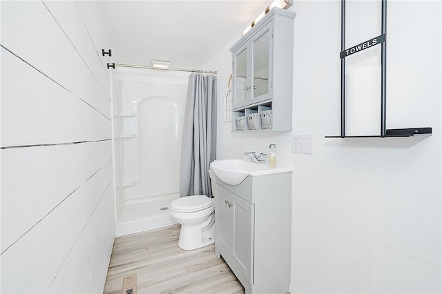336 Walkchalk Rd, East Franklin Twp, PA 16201 - full bathroom featuring vanity, toilet, a stall shower, and wood finished floors