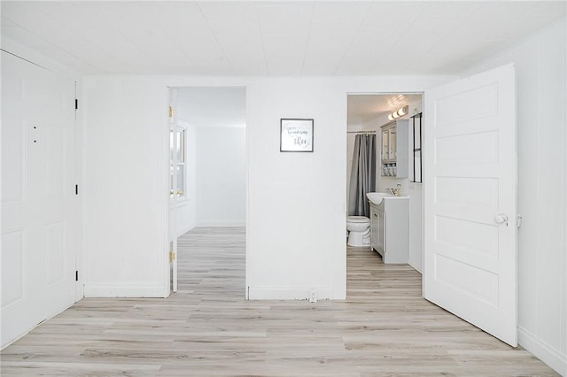 336 Walkchalk Rd, East Franklin Twp, PA 16201 - unfurnished room featuring light wood-style floors, baseboards, and a sink