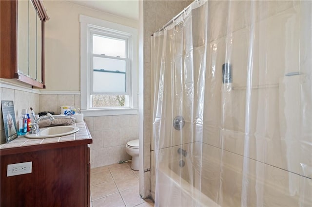 2979 Ruthwood Ave, Baldwin Boro, PA 15227 - full bathroom with toilet, tile walls, tile patterned floors, vanity, and shower / bath combo with shower curtain