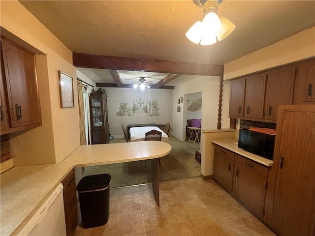 kitchen featuring a ceiling fan, light countertops, dishwasher, a peninsula, and brown cabinets