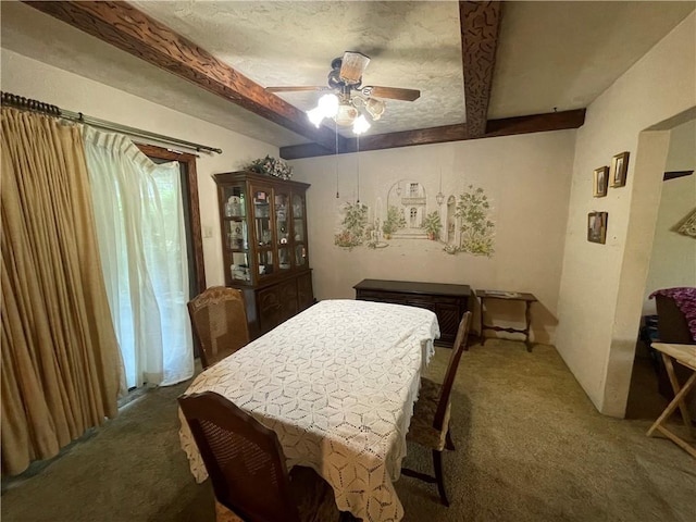 dining room with carpet, beam ceiling, and ceiling fan