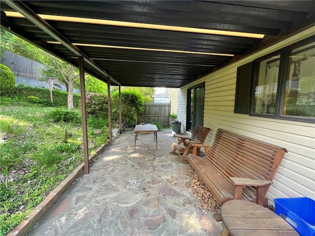 view of patio / terrace featuring fence