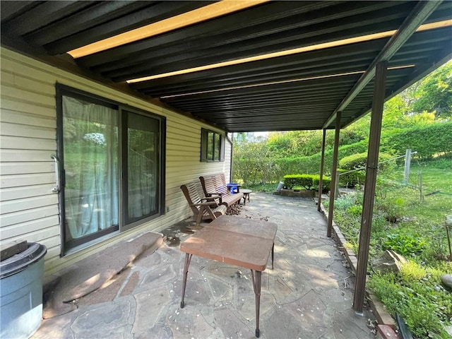 view of patio / terrace featuring fence