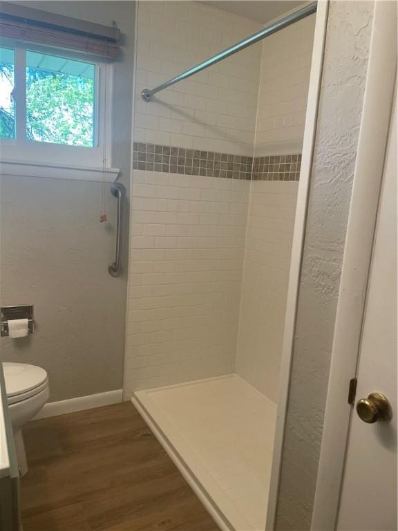 855 W Sanner St, Somerset Boro, PA 15501 - bathroom featuring wood finished floors, a shower stall, toilet, and baseboards