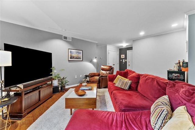 living room with crown molding, wood finished floors, recessed lighting, and baseboards