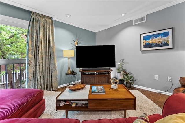 living area with ornamental molding, baseboards, wood finished floors, and recessed lighting