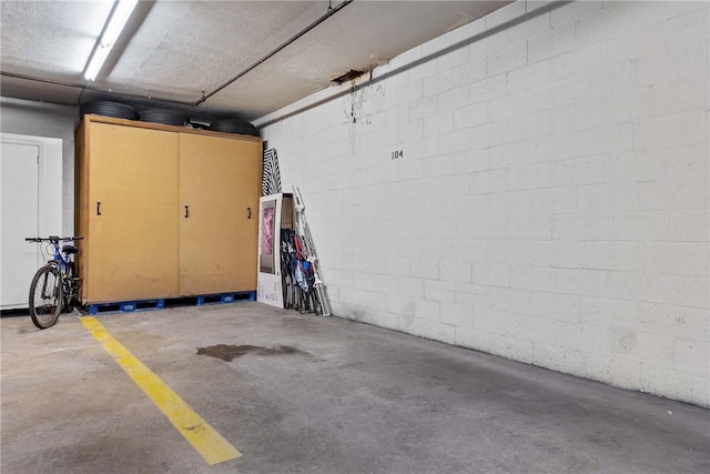 parking deck featuring concrete block wall