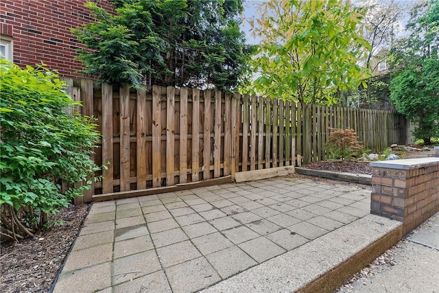 view of patio featuring fence