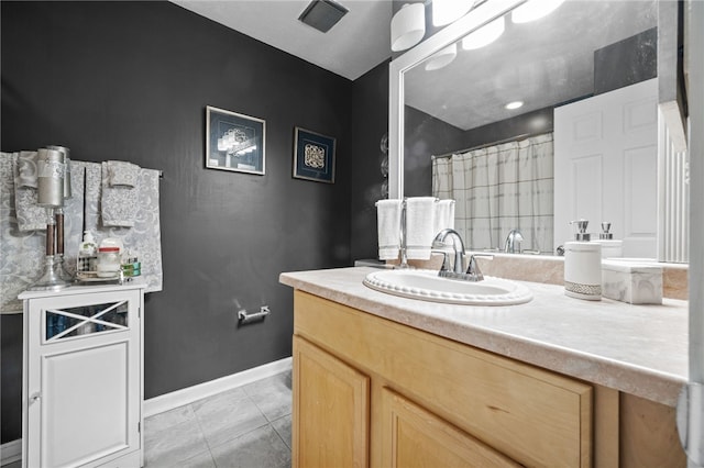 full bathroom featuring baseboards, vanity, a shower with shower curtain, and tile patterned flooring