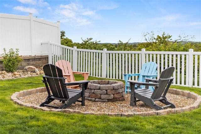 view of patio featuring an outdoor fire pit and fence