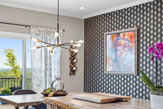 dining area featuring a chandelier, an accent wall, wallpapered walls, ornamental molding, and recessed lighting