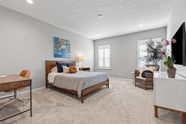 bedroom featuring light colored carpet, baseboards, recessed lighting, an office area, and a textured ceiling