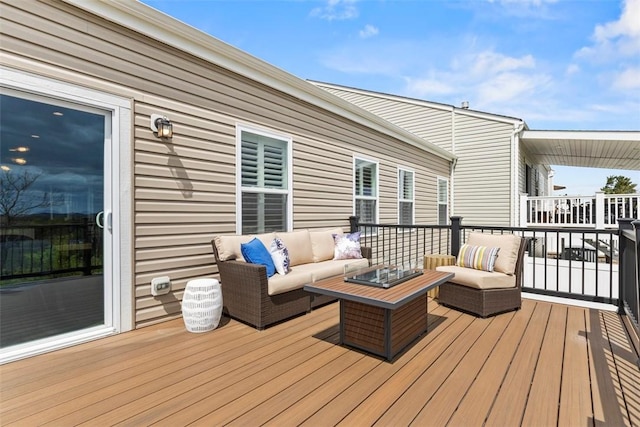 wooden deck with an outdoor hangout area